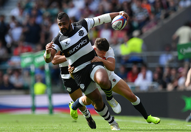LONDON, ENGLAND - JUNE 02: Taqele Naiyaravoro of the Barbarians is tackled by Piers O'Conor of England during the Quilter Cup match between England and the Barbarians at Twickenham Stadium on June 02, 2019 in London, England. (Photo by Dan Mullan/Getty Images)